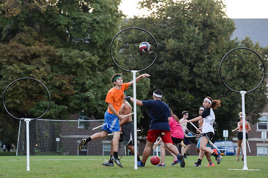 A player trying to score during a quidditch match.